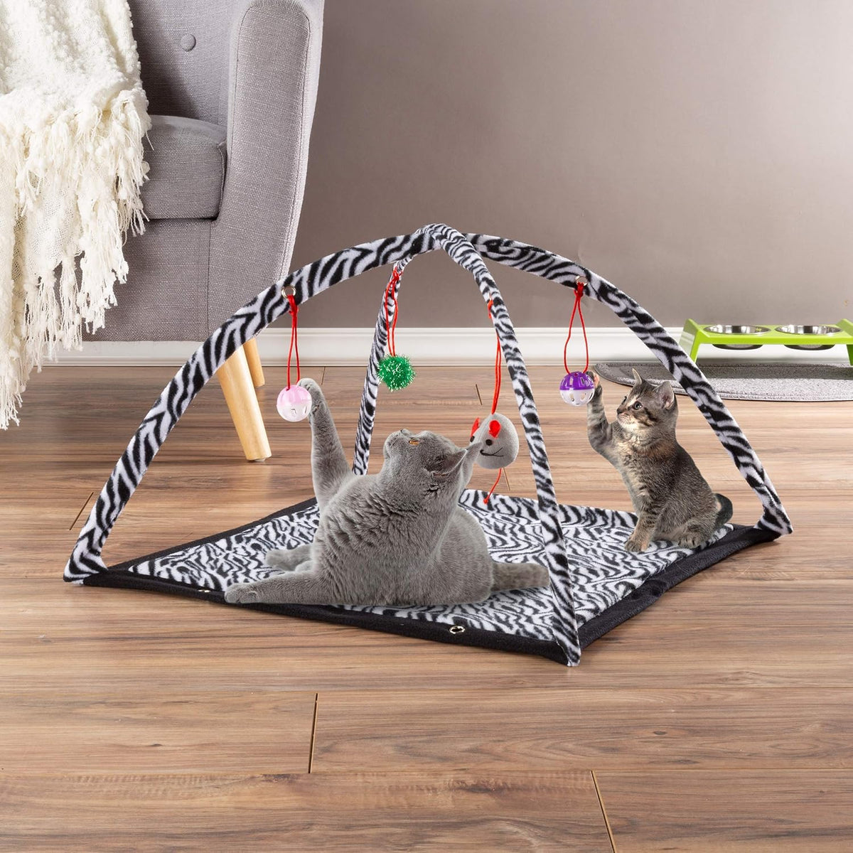 Close up view of the four interactive hanging toys on the Petmaker cat exercise station.