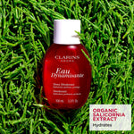 Clarins treatment fragrance spray bottle showcasing label and size details
