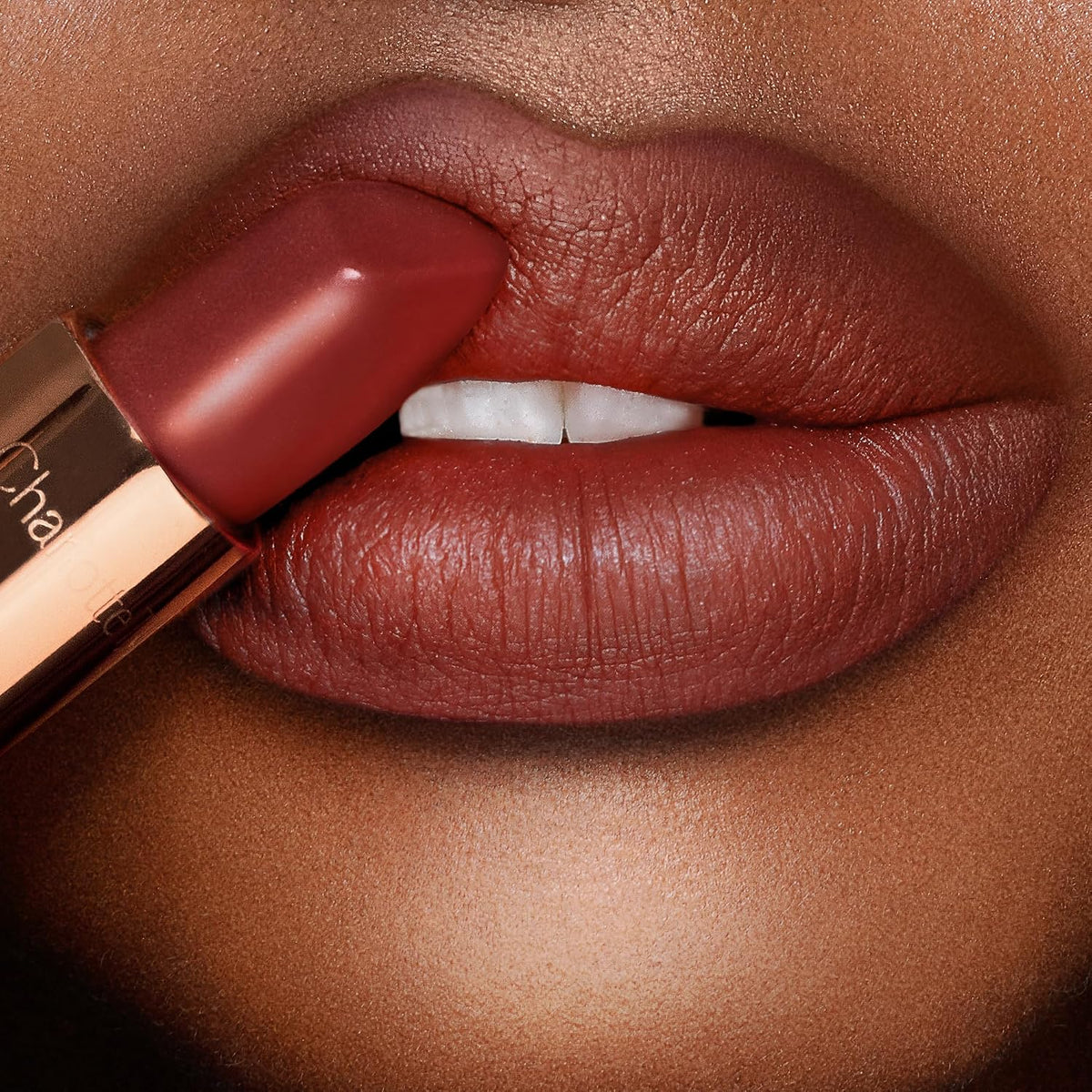 Model wearing Charlotte Tilbury Matte Revolution for a soft matte look
