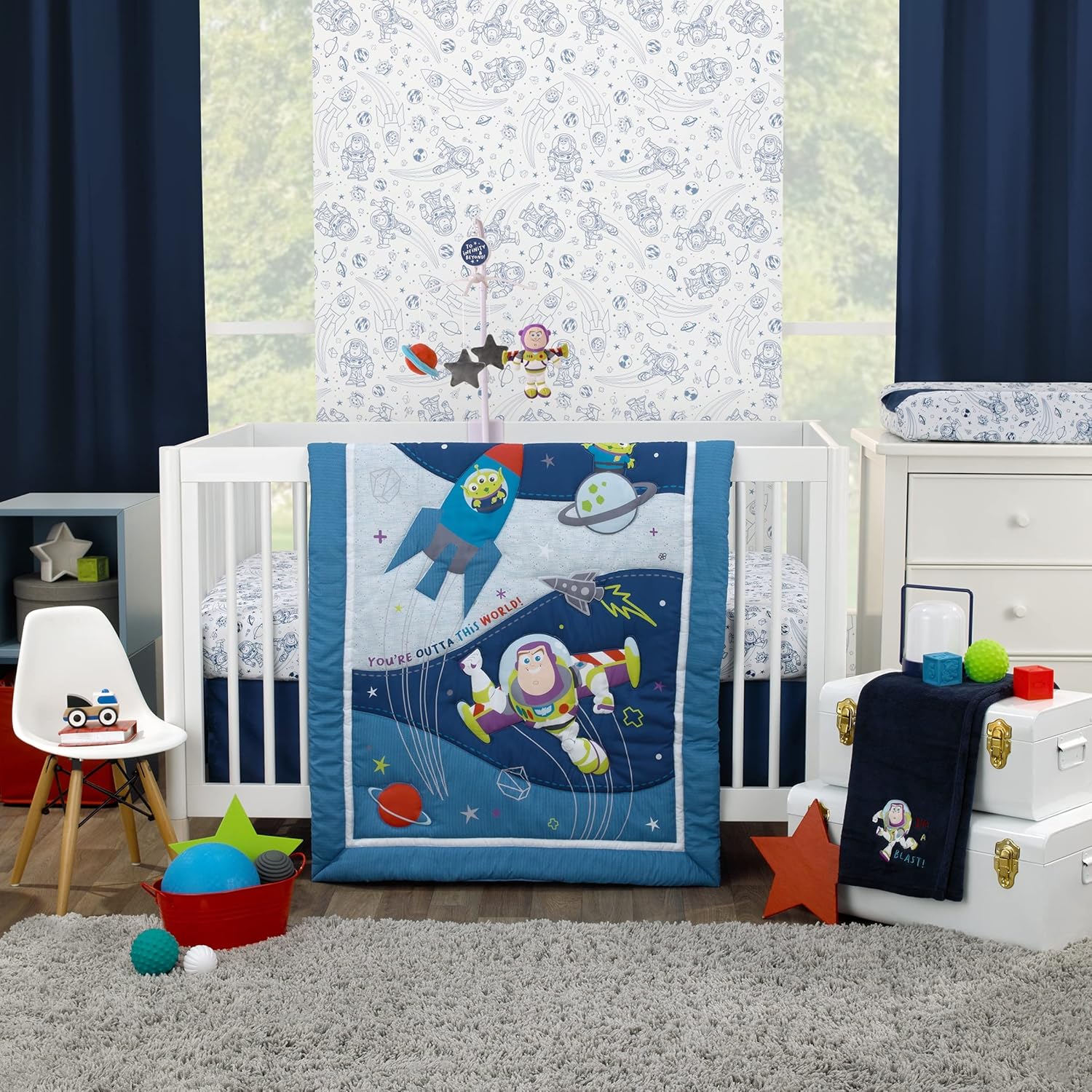 Disney Toy Story Outta This World nursery bedding set front view showcasing the blue Buzz Lightyear comforter.