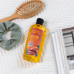 Cold-pressed jojoba oil texture poured on hand