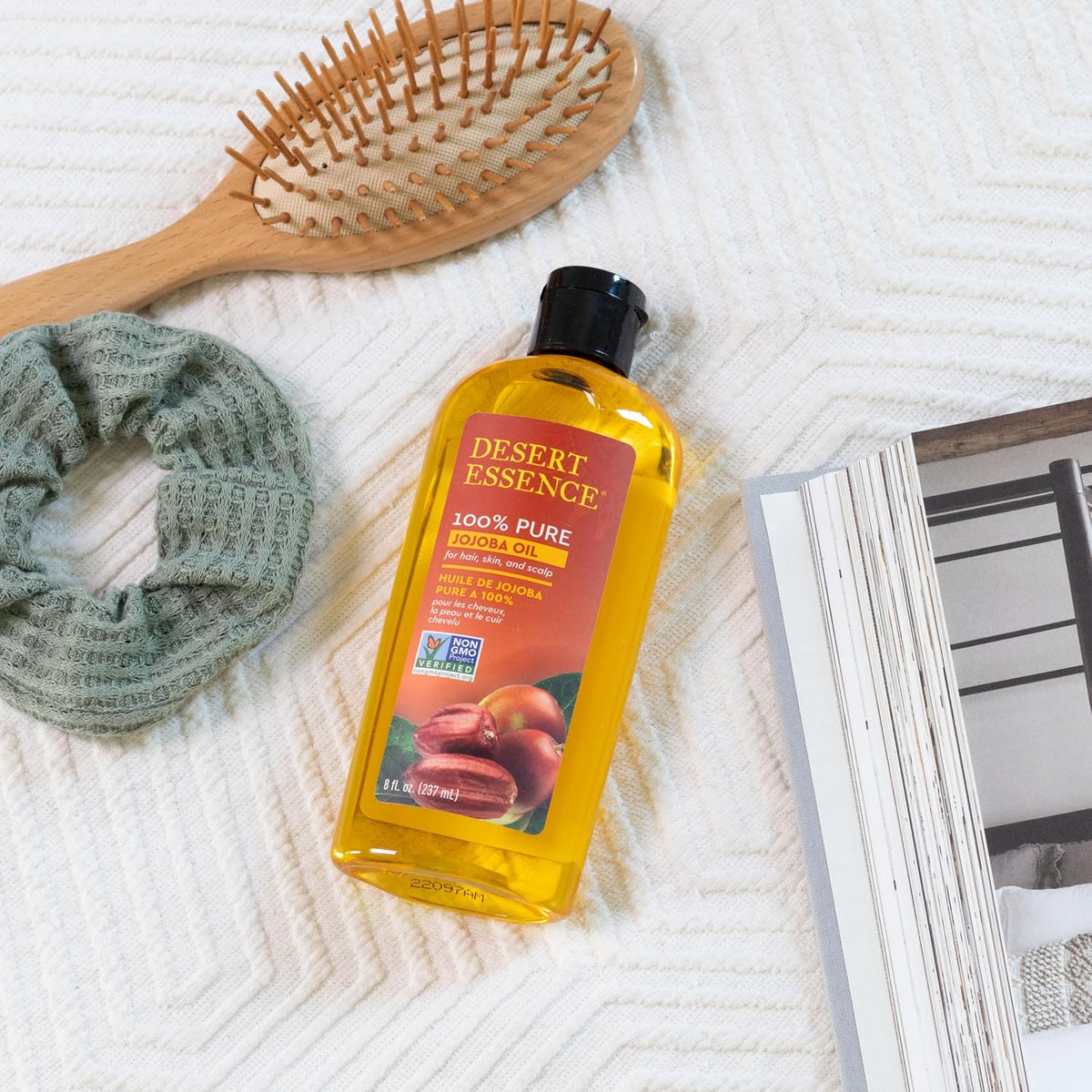Cold-pressed jojoba oil texture poured on hand