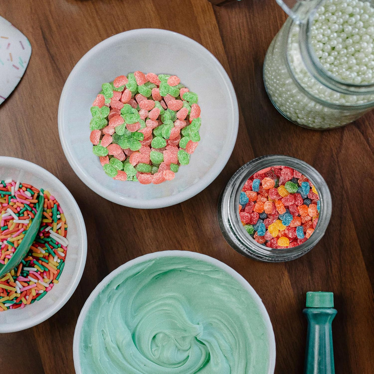 Sour Patch Kids Bites gummy candy scattered on surface