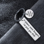 Side angle view of the silvery novelty keychain showcasing its durable hardware.