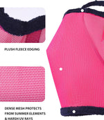 Side view of horse wearing magenta fly mask