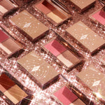 Premium Charlotte Tilbury mini compact displayed open highlighting the smooth blurring formulas.