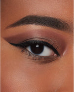 Swatches of the highly pigmented Milani Salt-N-Pepa eyeshadow shadows on medium skin tone.