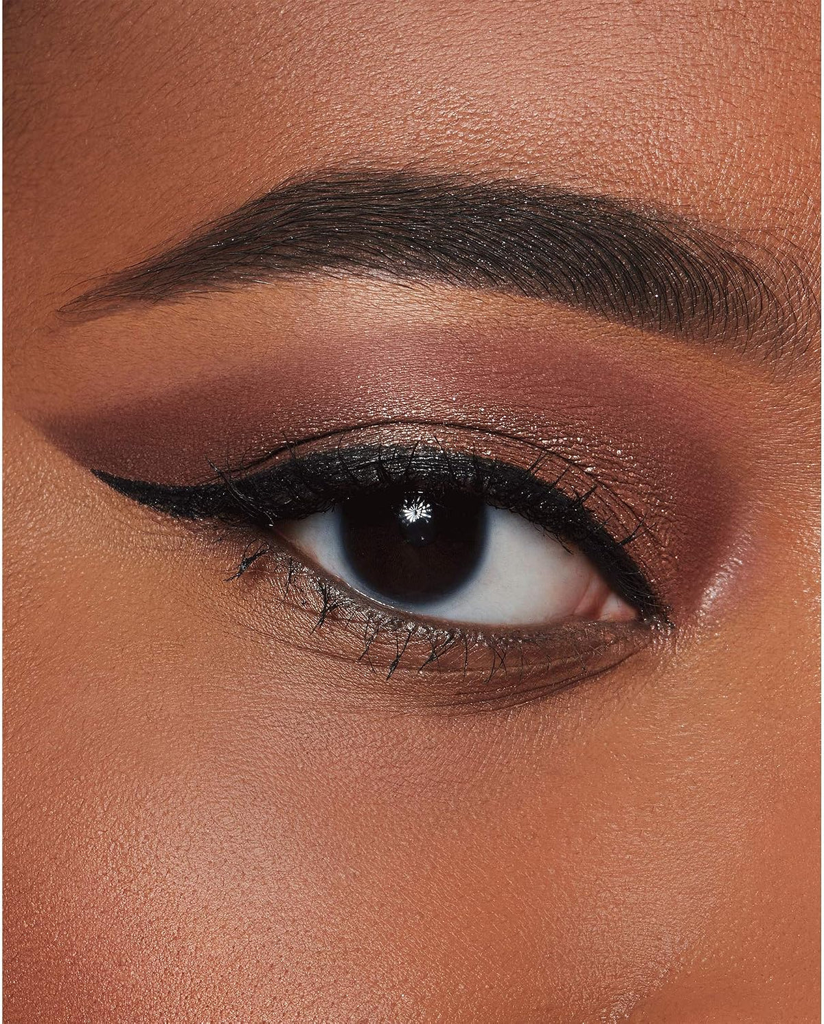 Swatches of the highly pigmented Milani Salt-N-Pepa eyeshadow shadows on medium skin tone.