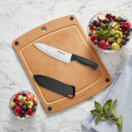 Side view of Farberware high-carbon steel kitchen knife inserted into protective cover