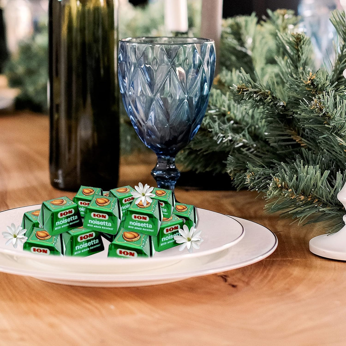 Individually wrapped ION Noisetta green foil chocolate pralines