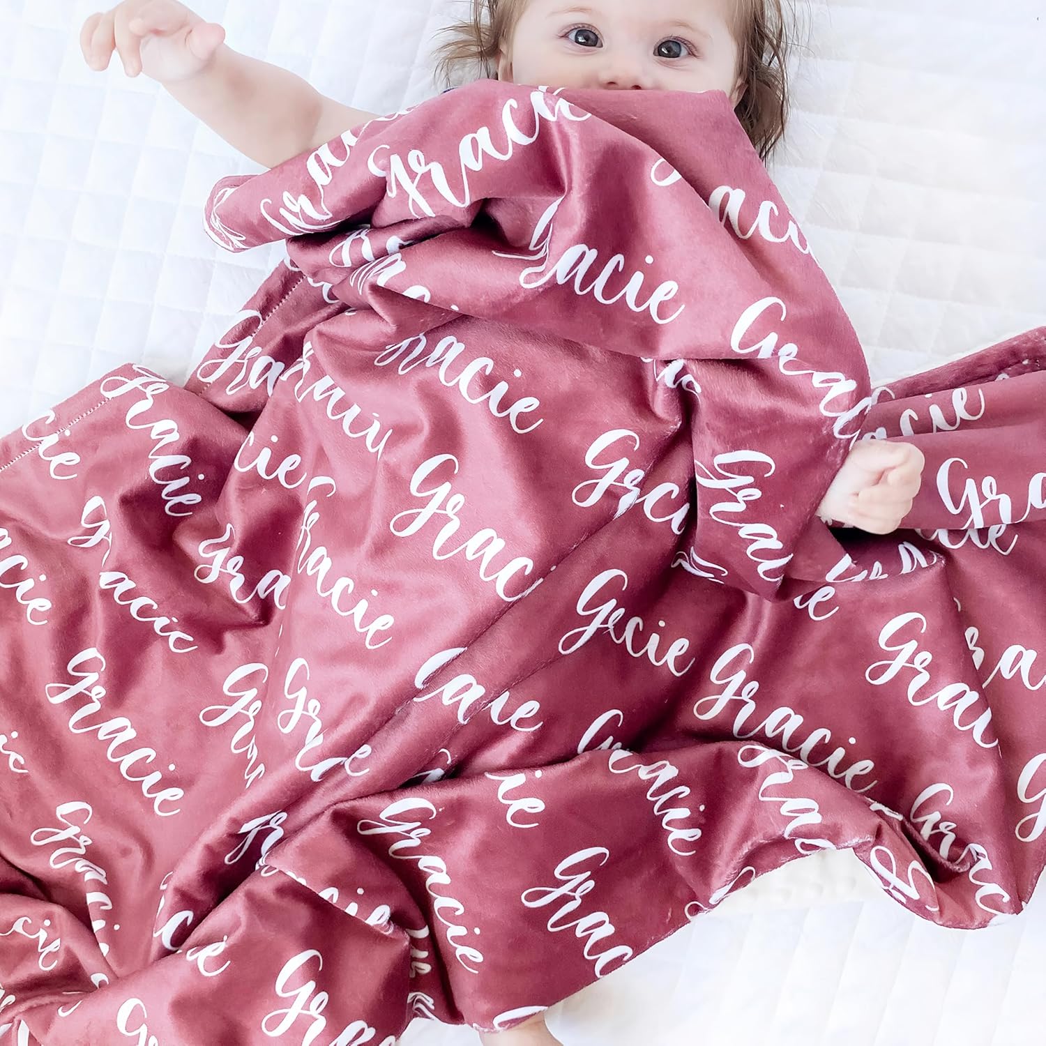 Yofair personalized baby blanket front view showing custom script name design on maroon plush flannel.