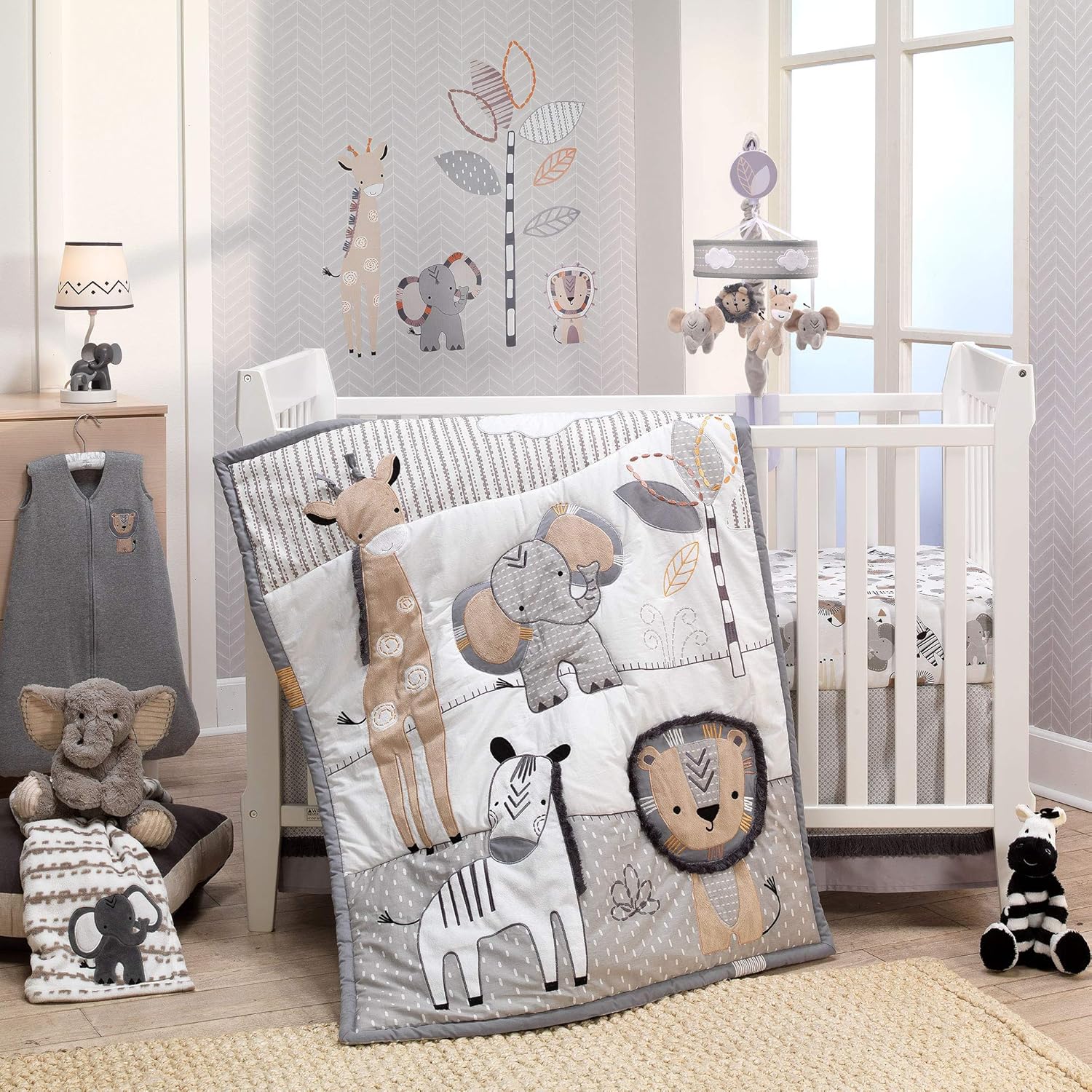 Lambs and Ivy Jungle Safari 6 Piece Baby Crib Bedding Set front view featuring the appliqued animal quilt in a decorated nursery setup.