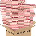 Close-up view of Muchai Innovations peppermint candy canes being used as hot chocolate stirrers.