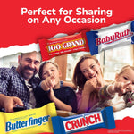 100 Grand and Butterfinger mini chocolate bars being poured into a candy bowl.