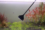 Algae scraper protective cover being utilized as a convenient gravel spatula inside a planted reef aquarium.