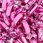 Vibrant hot pink party candy caramels by Candy Envy in individual packaging