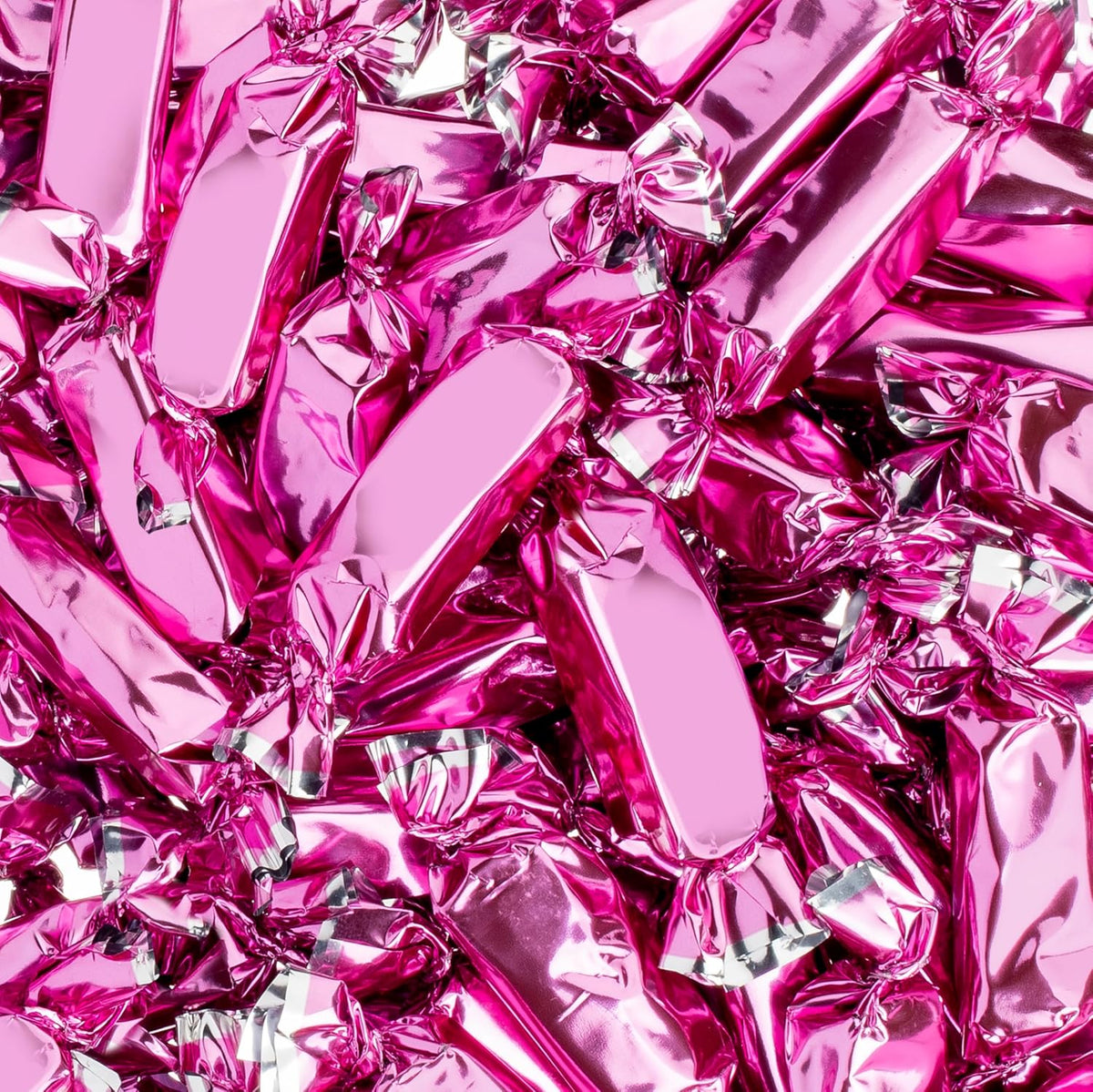 Vibrant hot pink party candy caramels by Candy Envy in individual packaging