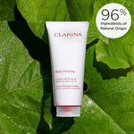 Clarins Extra-Firming Body Cream open jar revealing formula