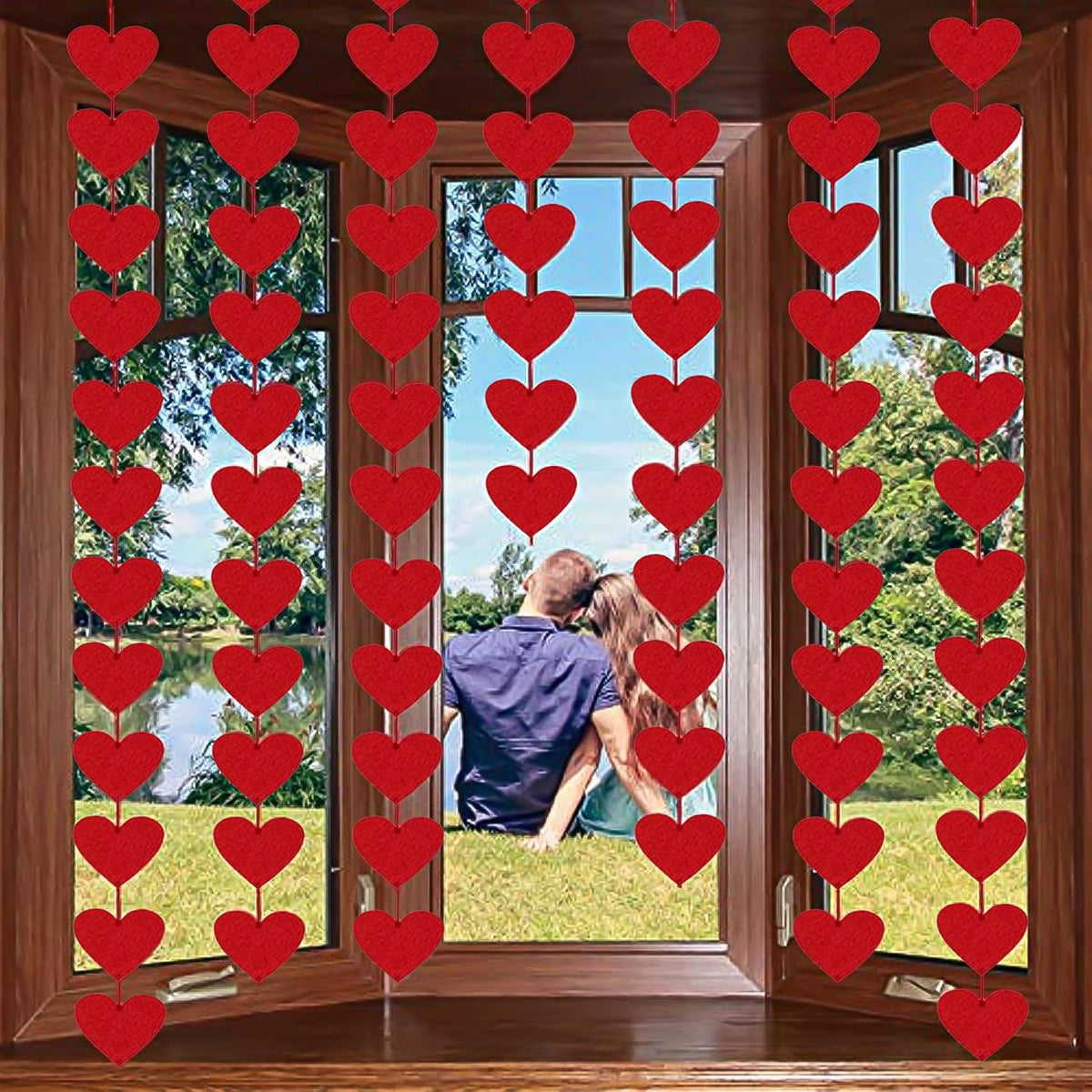 Partyprops 72 Red Hearts Felt Garland front view hanging beautifully against a white wall backdrop