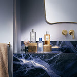 Lifestyle arrangement of Beckham Classic Blue spray bottle for men