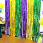OHOME Mardi Gras Streamers Backdrop front view showing purple gold green metallic foil fringe curtains.