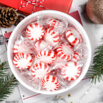 Festive holiday layout featuring BoostBox peppermint hard candies arranged as party table favors.