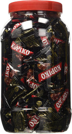 Hand holding a Kopiko coffee candy piece