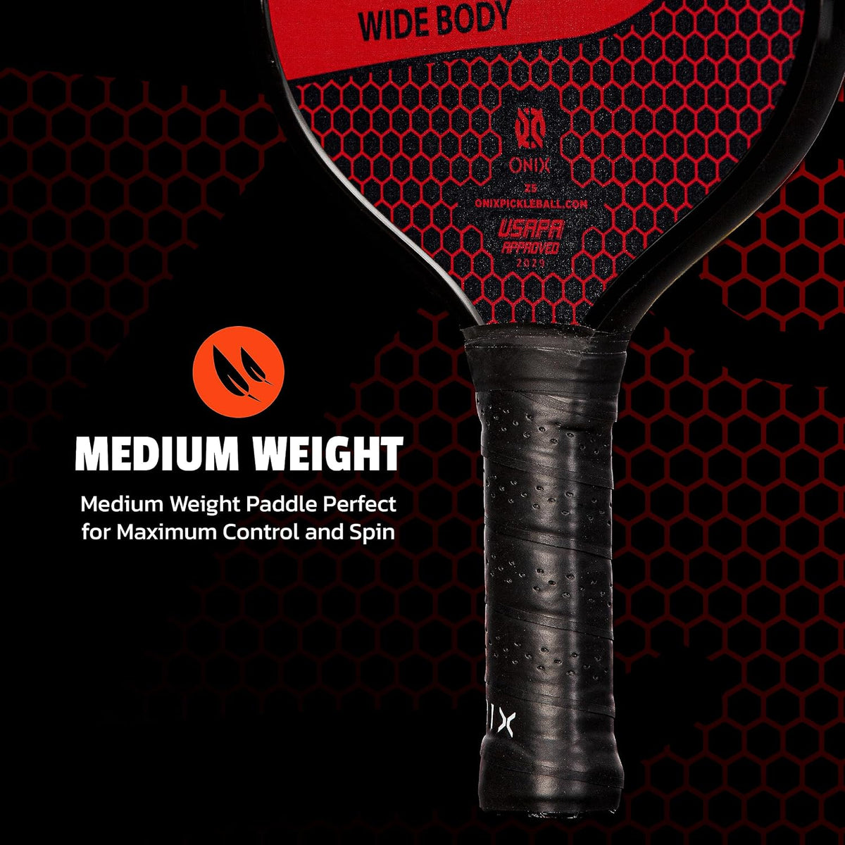 Player holding the Onix pickleball paddle during indoor court play