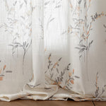 Living room setup featuring long farmhouse window drapes