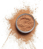 Top view of the cruelty free mattifying setting powder packaging on a clean surface.