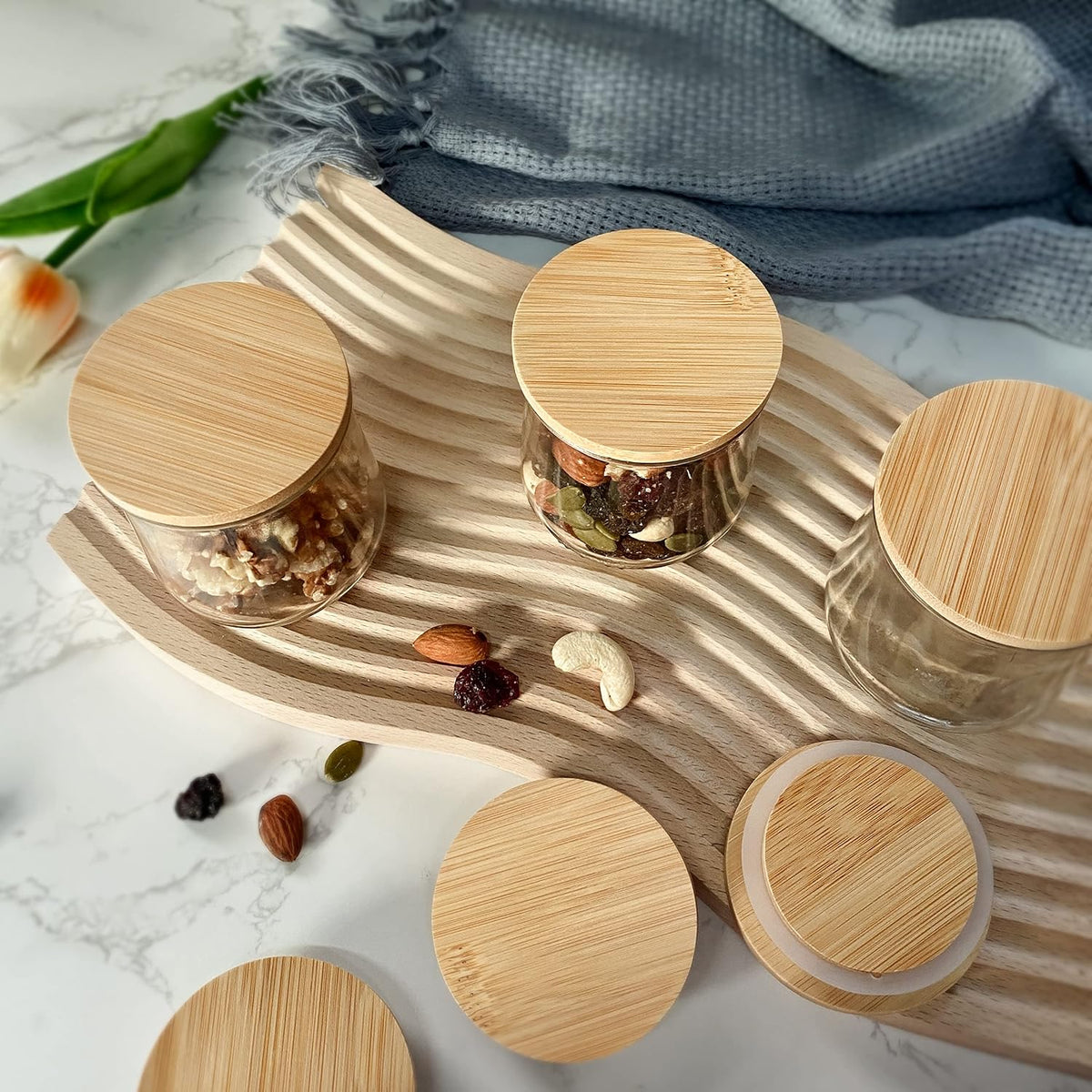 Kikiniko wooden jar lids stacked with silicone rings