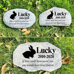Hand-painted memorial plaque for pets beside a walkway