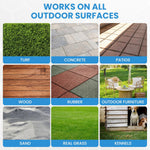 Backyard artificial turf lawn being sprayed with concentrated pet odor eliminator.