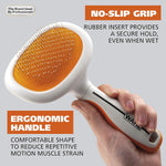 Wahl sensitive skin pet slicker tool being used to groom a long-haired dog.