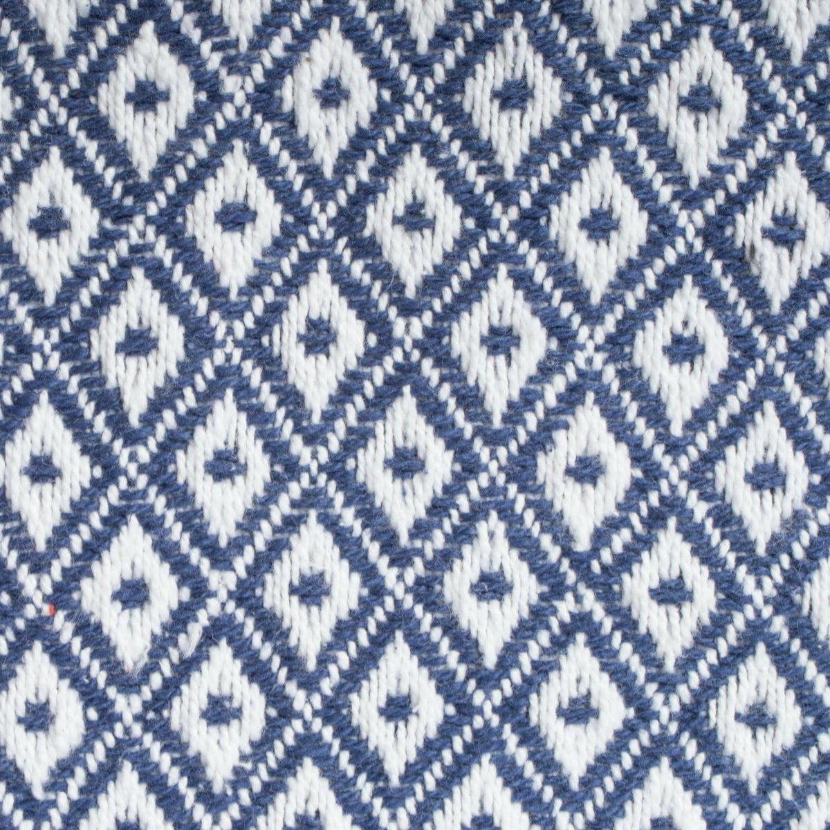 Nautical blue woven cotton throw folded on chair