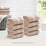 Set of Belador luxury 13x13 inch hand towels neatly rolled for travel