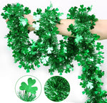 Regteb St Patricks Day green shamrock tinsel garland front view hanging on a living room fireplace mantel.