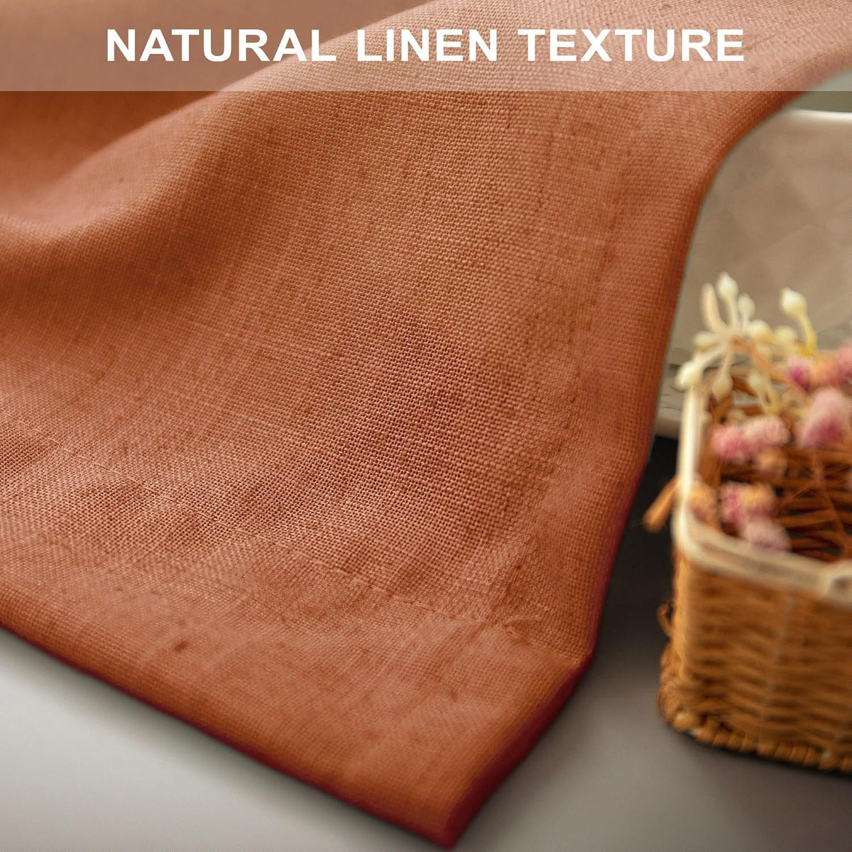 Sunlight diffusing through the semi sheer orange linen curtains.