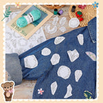 Hand sewing embroidery stitches over the blossom pattern guide