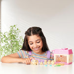 Child feeding the interactive mama bunny toy with celery