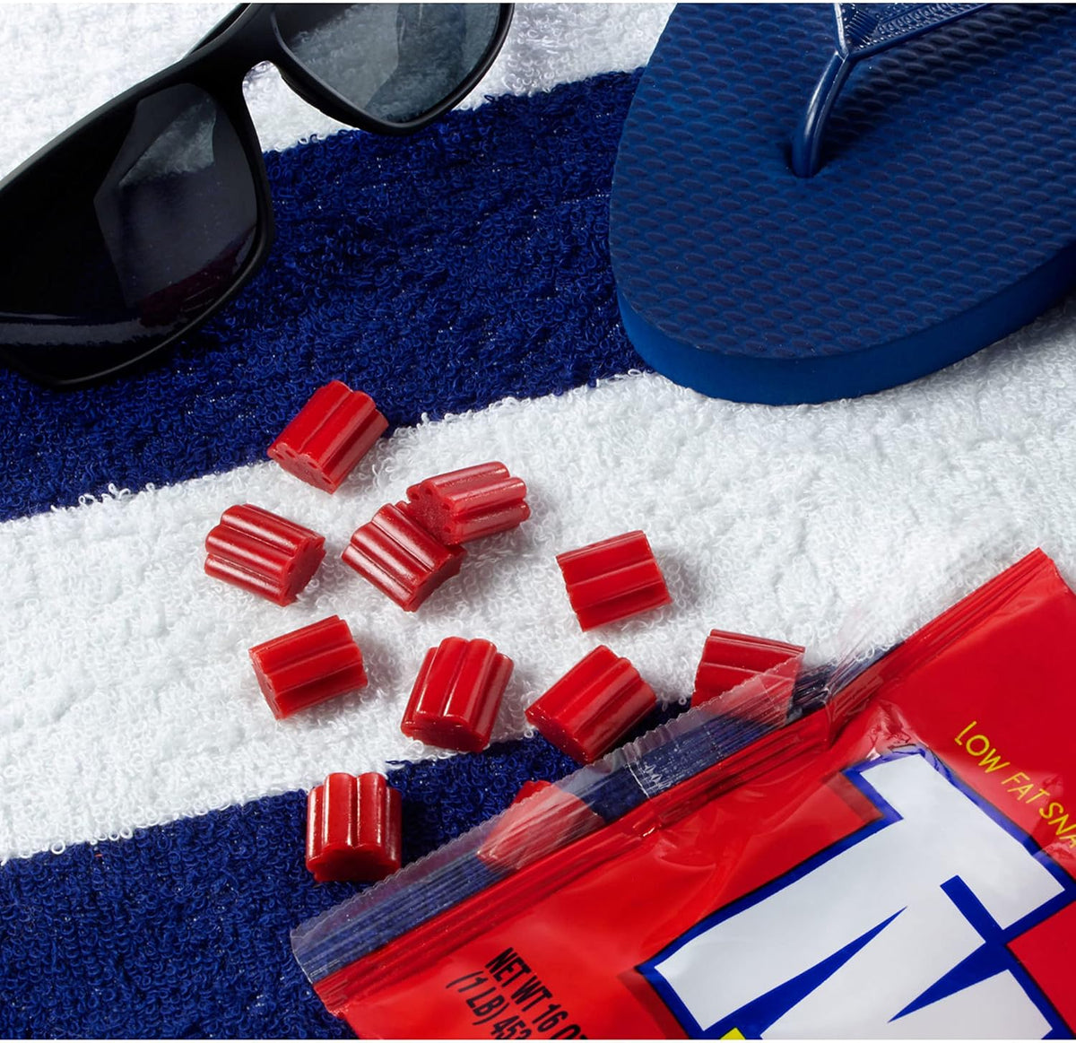 Low fat kosher certified cherry licorice bites held in hand