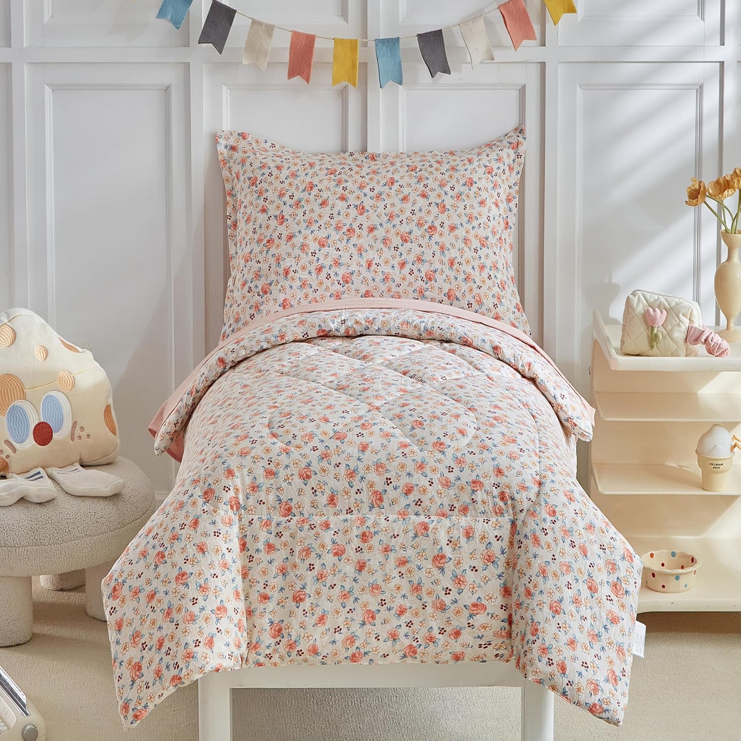 DuShow toddler bedding set for girls front view featuring pink floral comforter on a crib bed