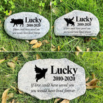 Decorative pet grave marker in a peaceful garden setting