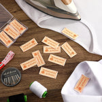 Assorted handmade craft accessories featuring custom fabric tags