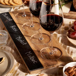 Twine acacia wood wine flight board close up on slate label strip