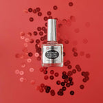 Nail-Aid 0.55 fluid ounce top coat bottle on a clean surface