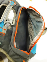 Side angle of the Cesar Millan dog saddlebag showing the spacious storage compartments and weatherproof nylon material.