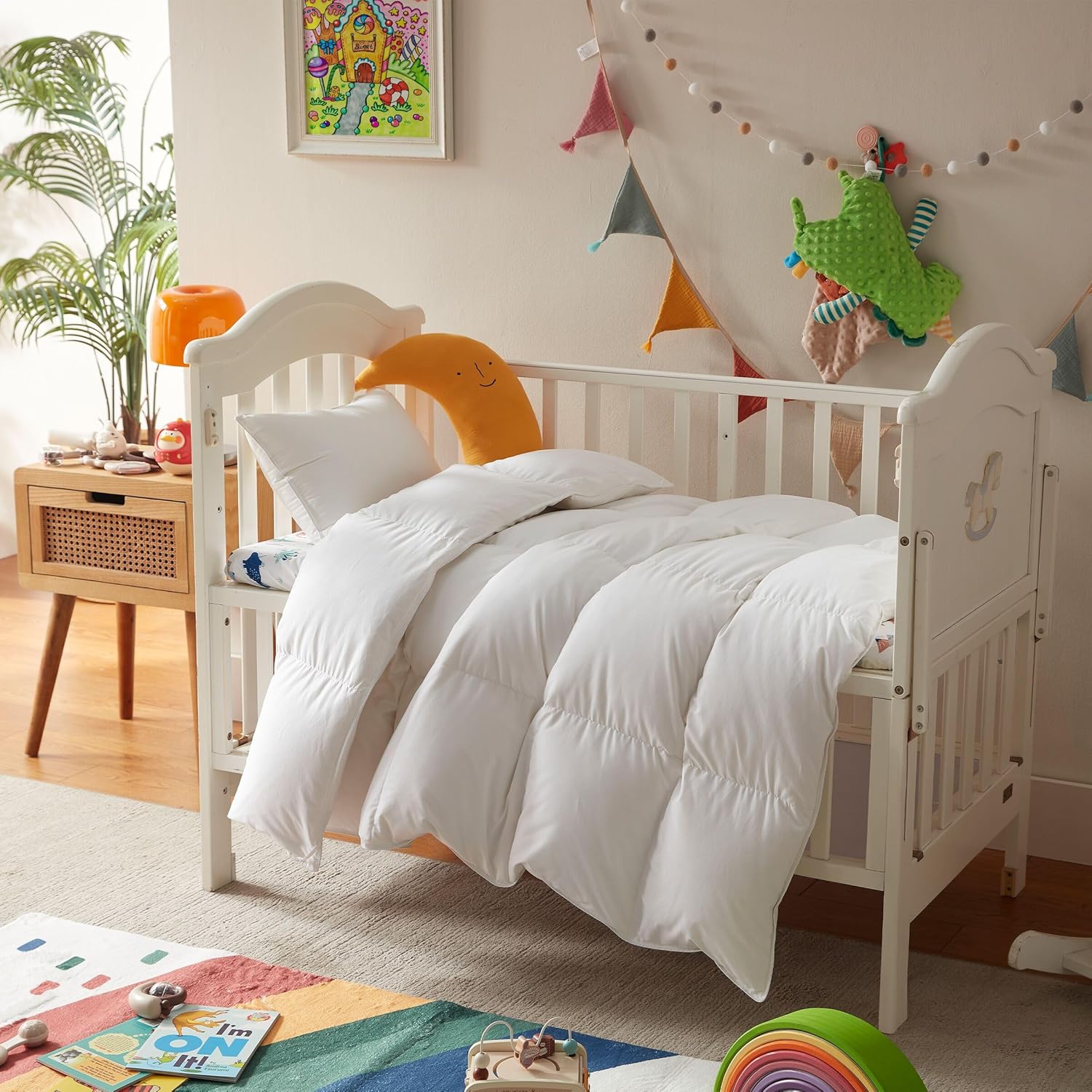 Three Geese Lightweight Toddler Comforter front view layout on a white crib bed