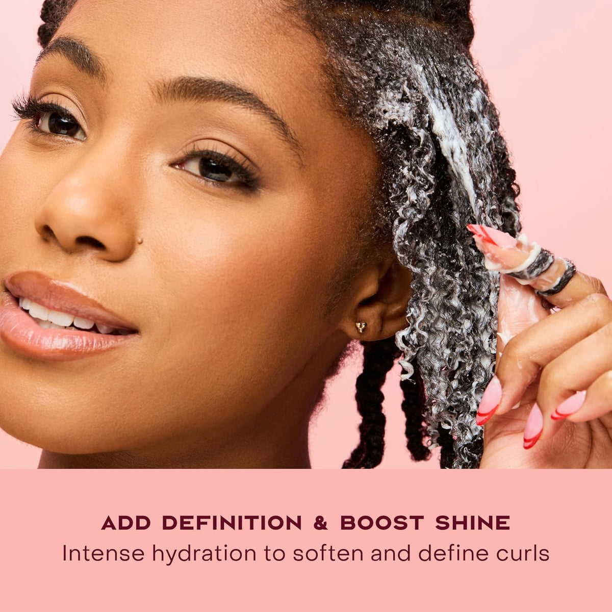 Shea Moisture coconut and hibiscus jar next to natural ingredients
