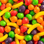 Handful of Wonka Runts candy in various fruit shapes